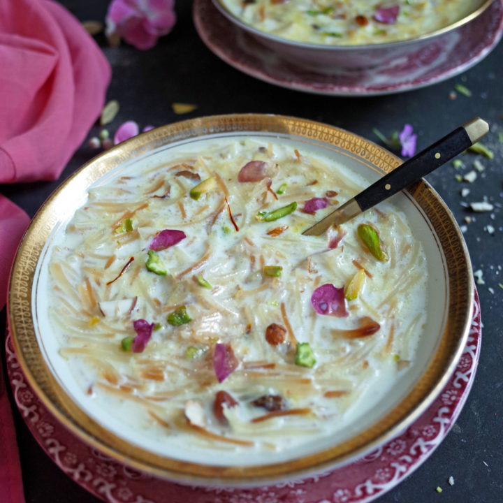 Seviyan Kheer topped with rose and pistachio in a white and gold bowl