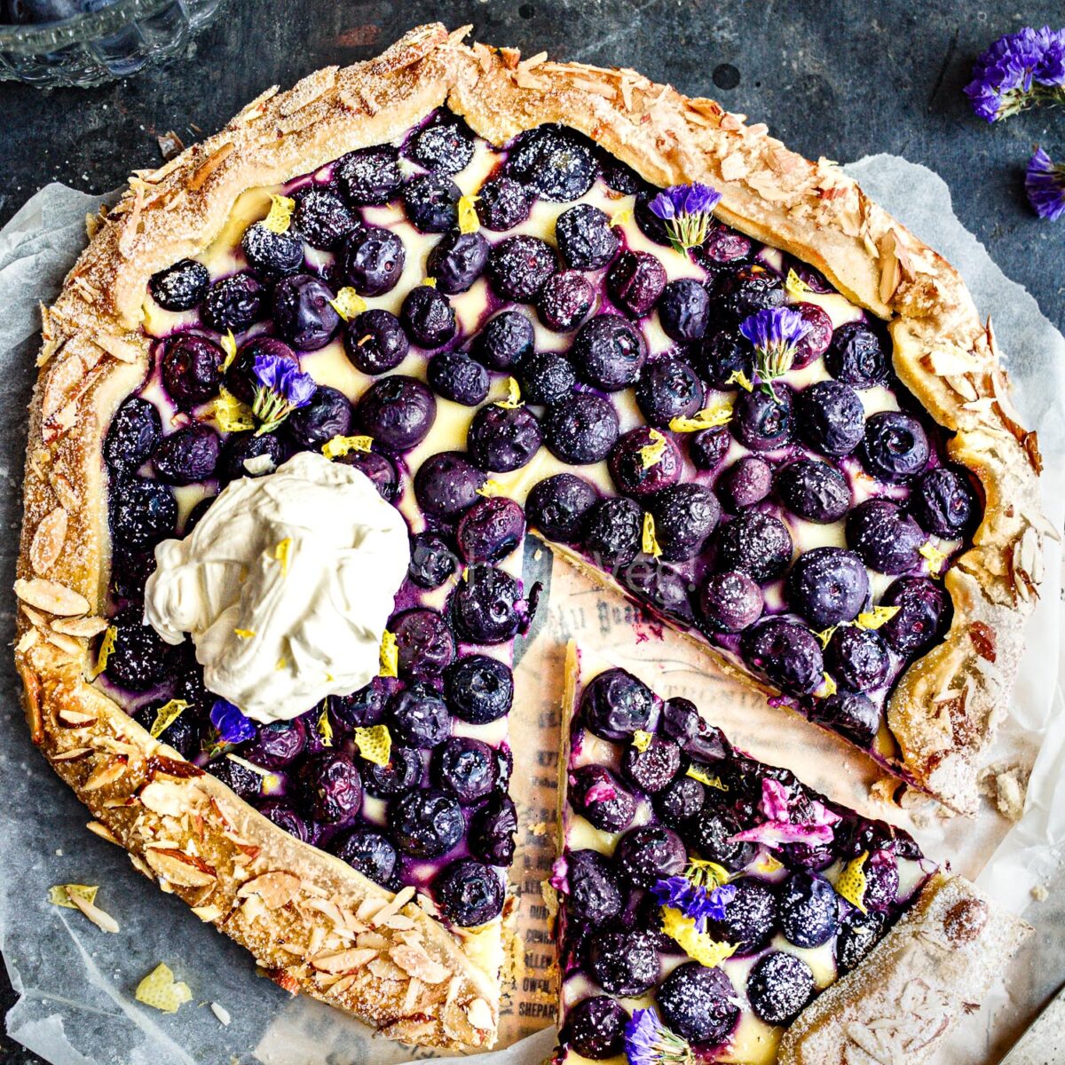 Blueberry cheesecake galette with cream.