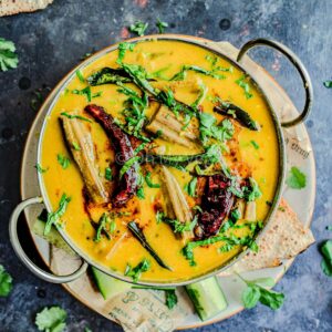 Drumstick dal in a metal bowl.