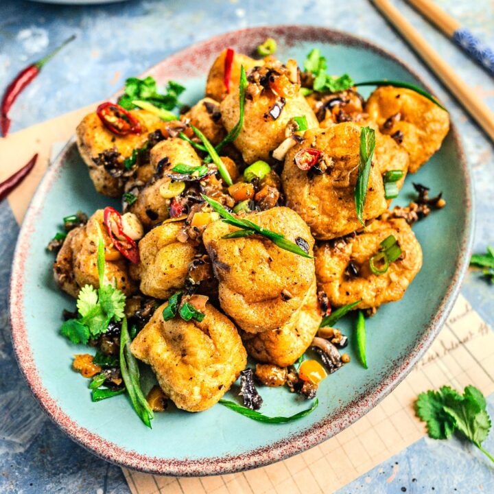 Salt and pepper tofu on a plate.