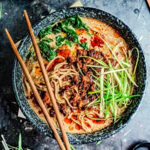 Bowl of vegan tantanmen ramen with chopsticks laying across the top.