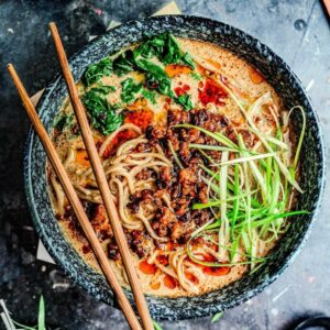 Bowl of vegan tantanmen ramen with chopsticks laying across the top.