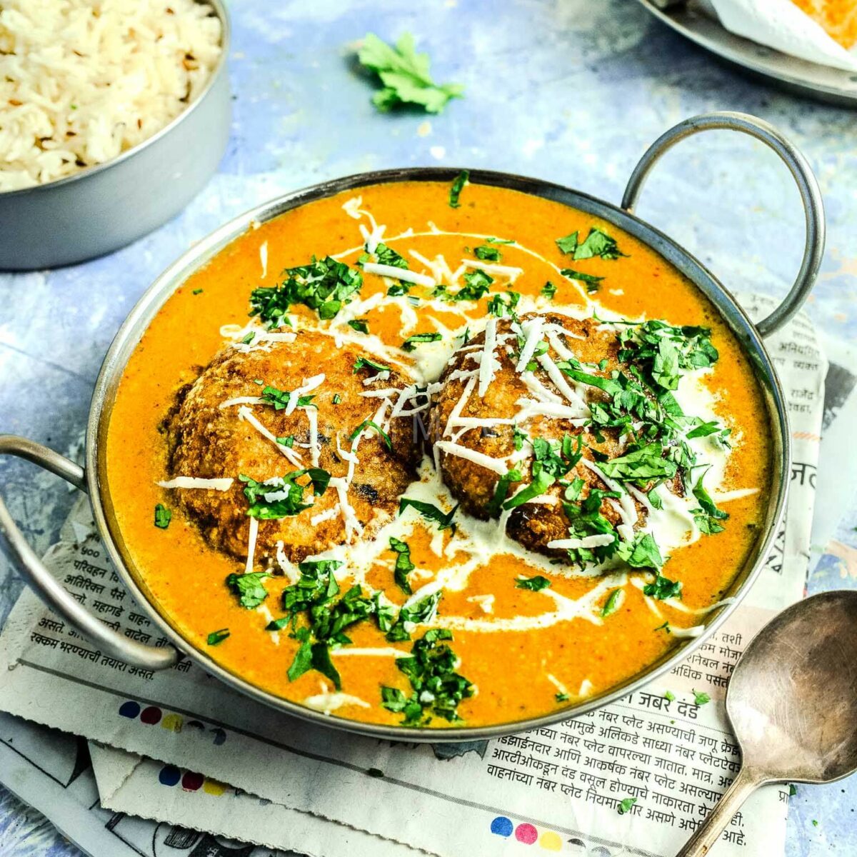 Malai kofta curry in a kadai.