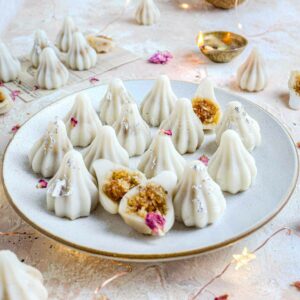 Ukadiche modak with coconut in the background.