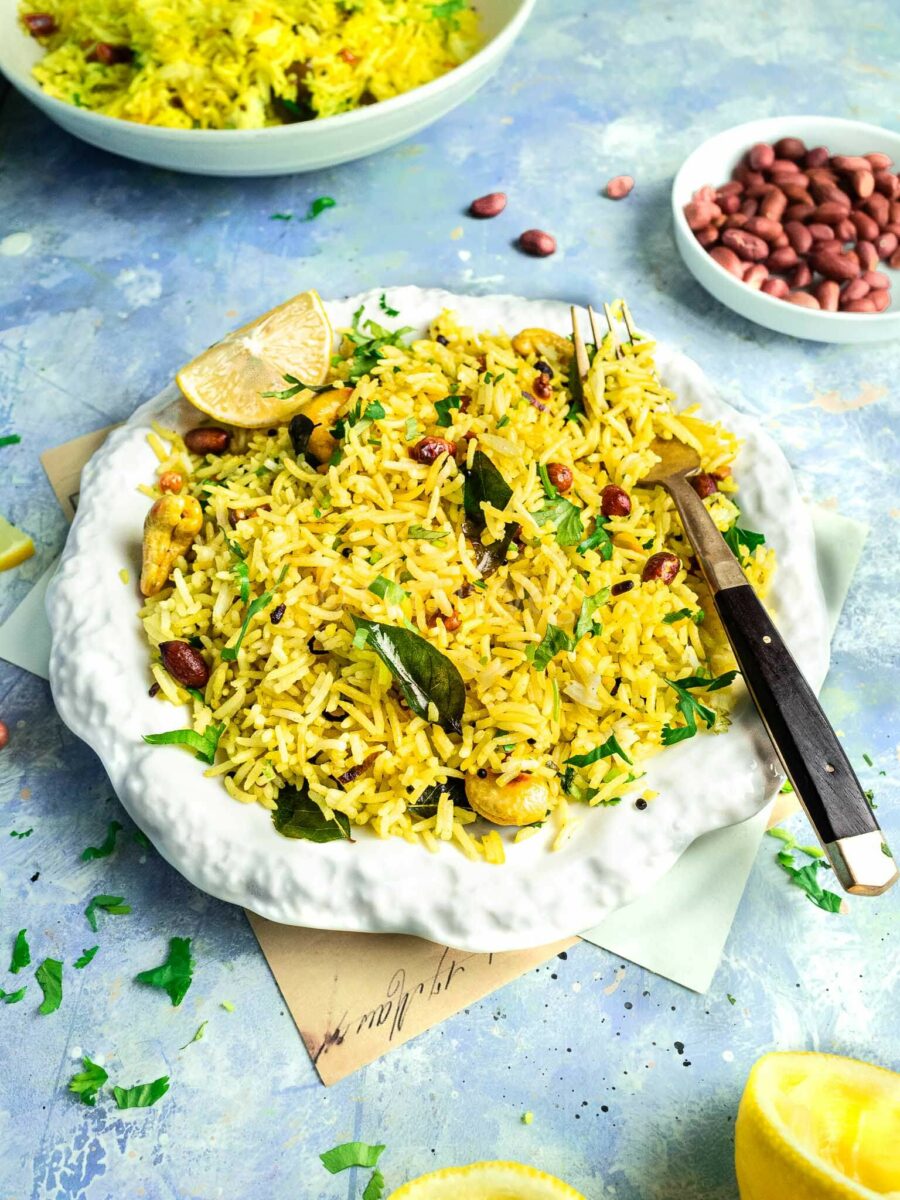 South Indian lemon rice on a white plate. 