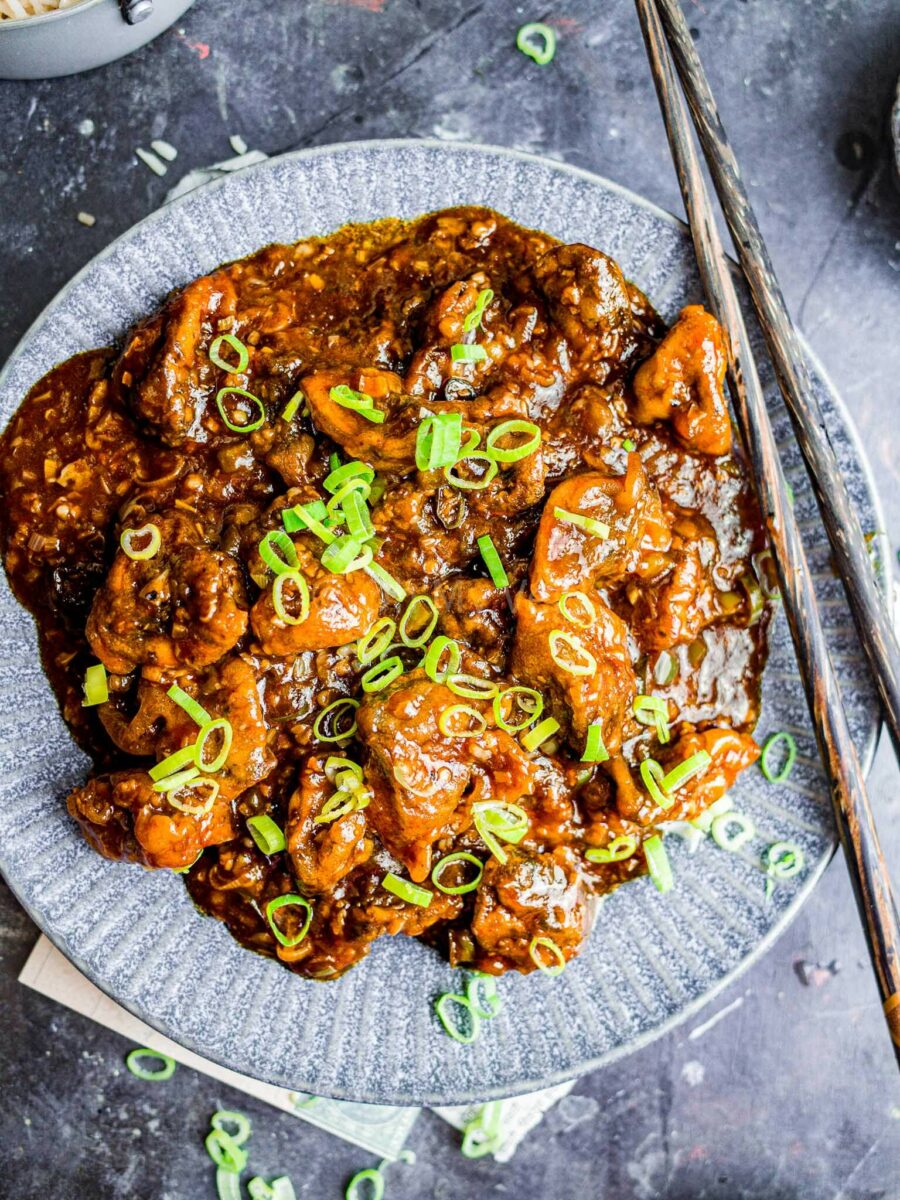 Mushroom manchurian on a grey plate.