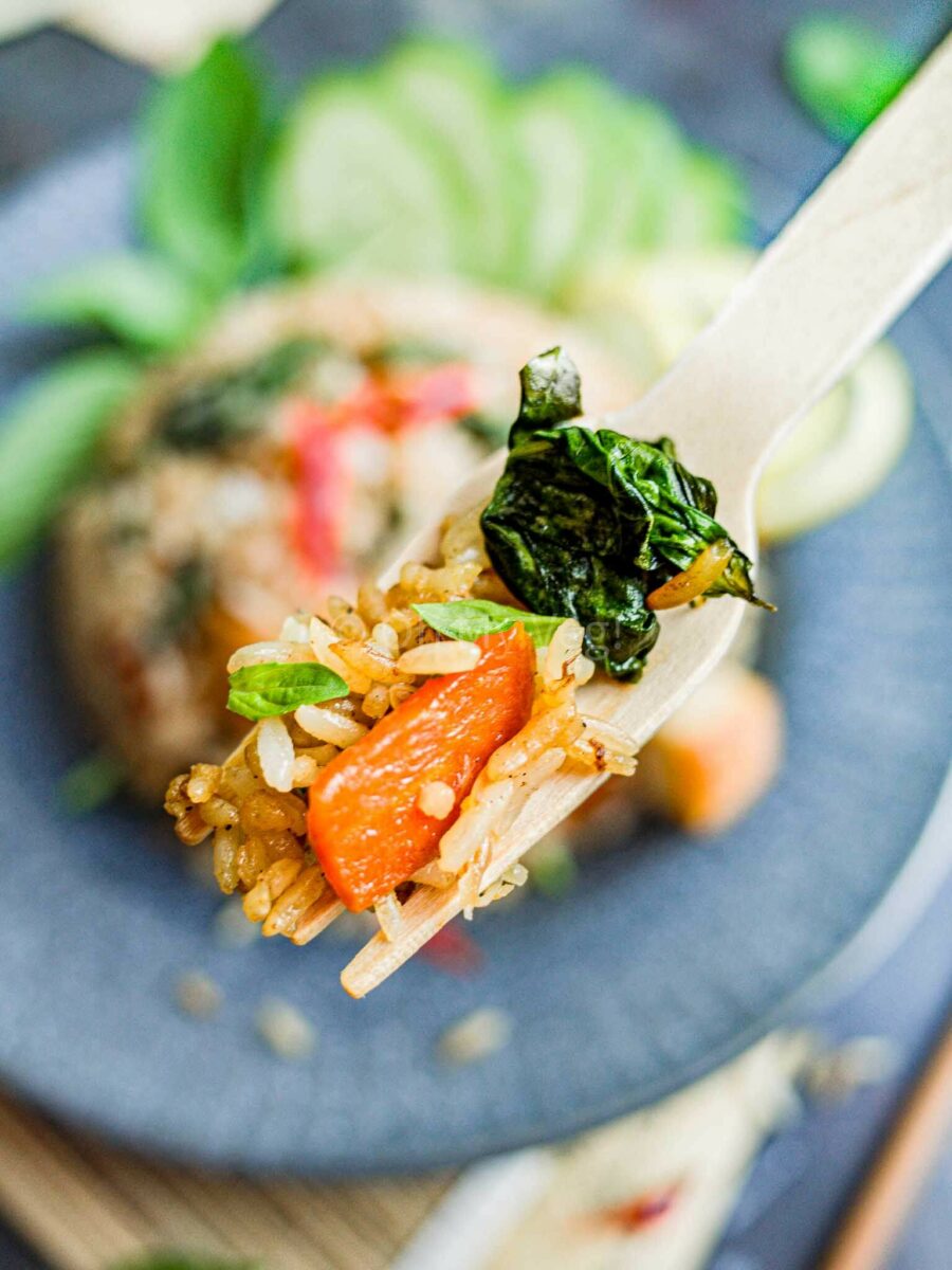 Wooden fork with Thai fried rice.