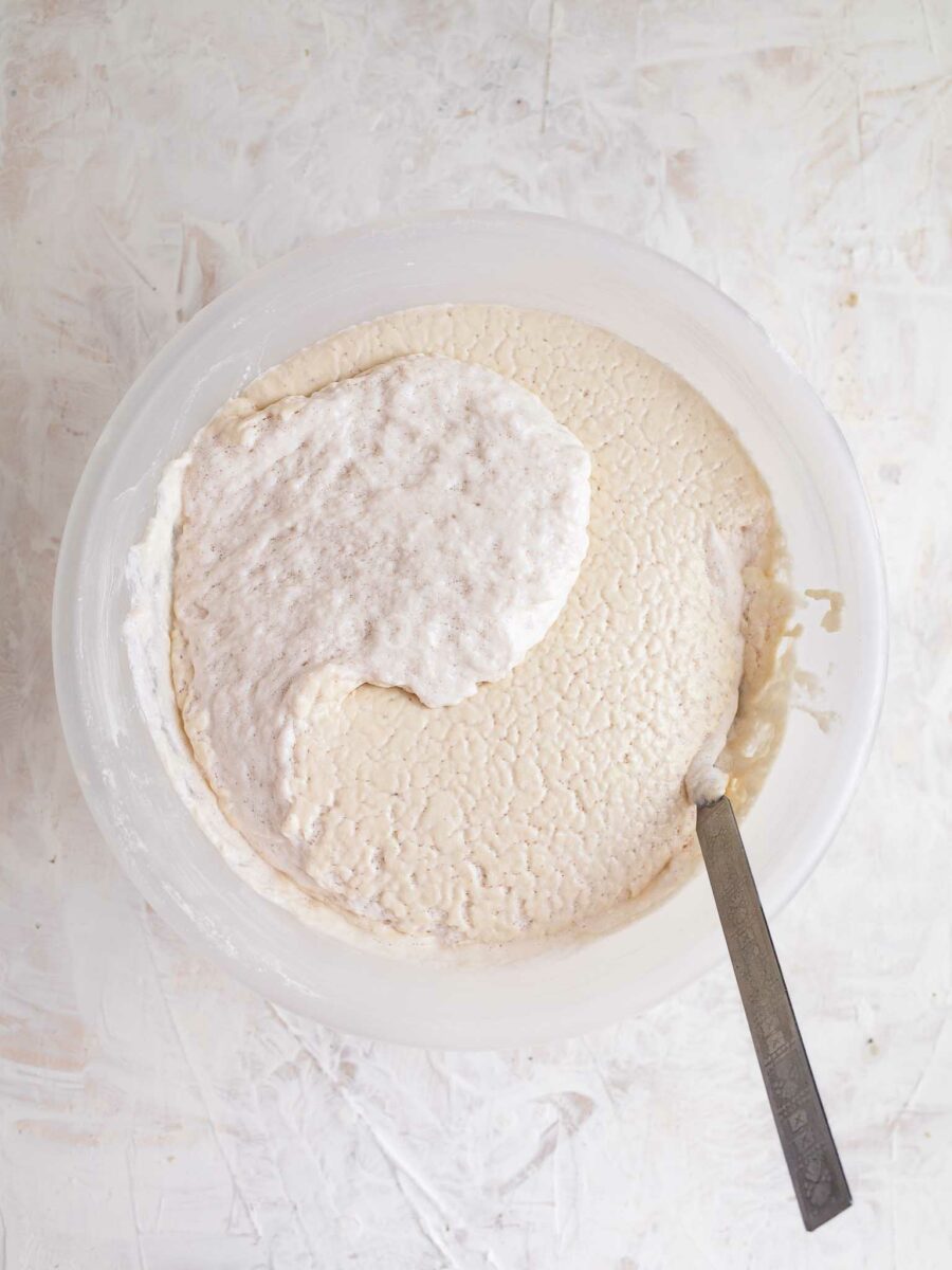 Mixing fermented dosa batter.