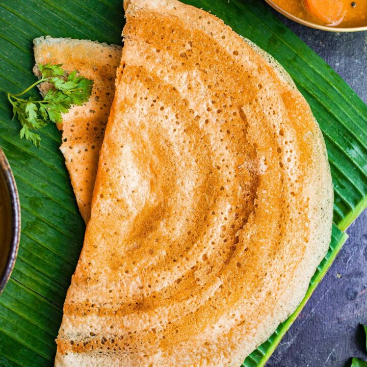 Gluten free dosa on a banana leaf.