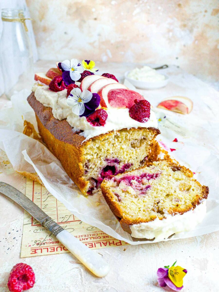 Peach Melba Loaf cake on a white background.