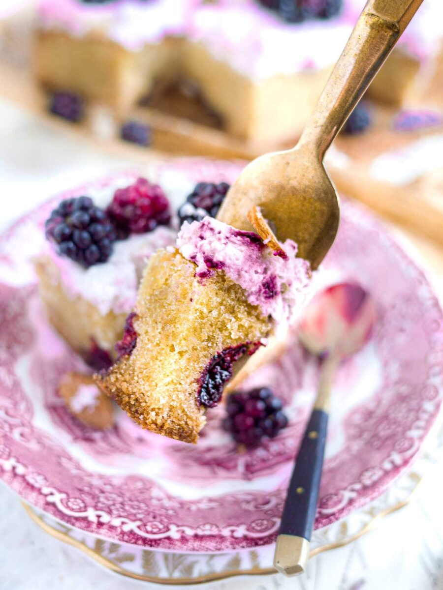 Fork with a piece of blackberry cake on it. 