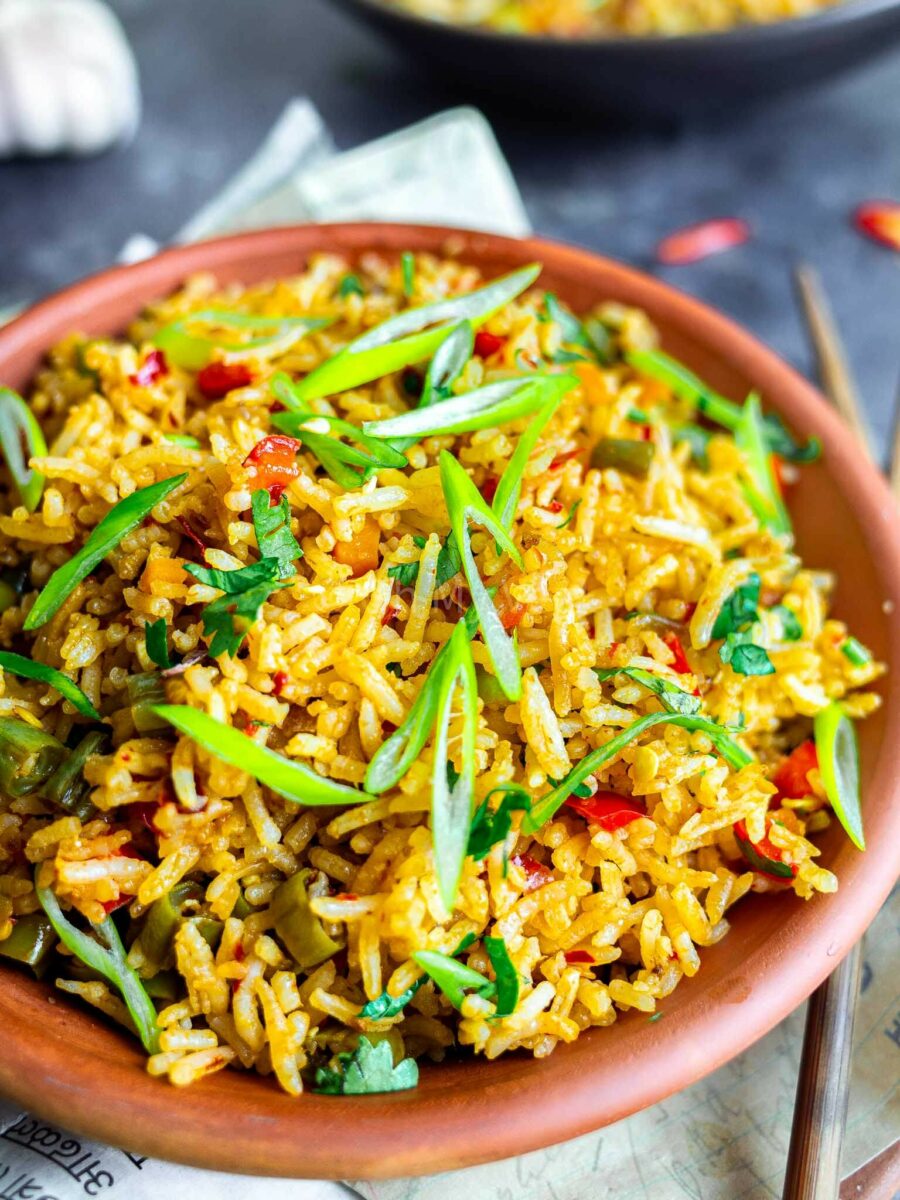 Chilli garlic fried rice topped with spring onions.