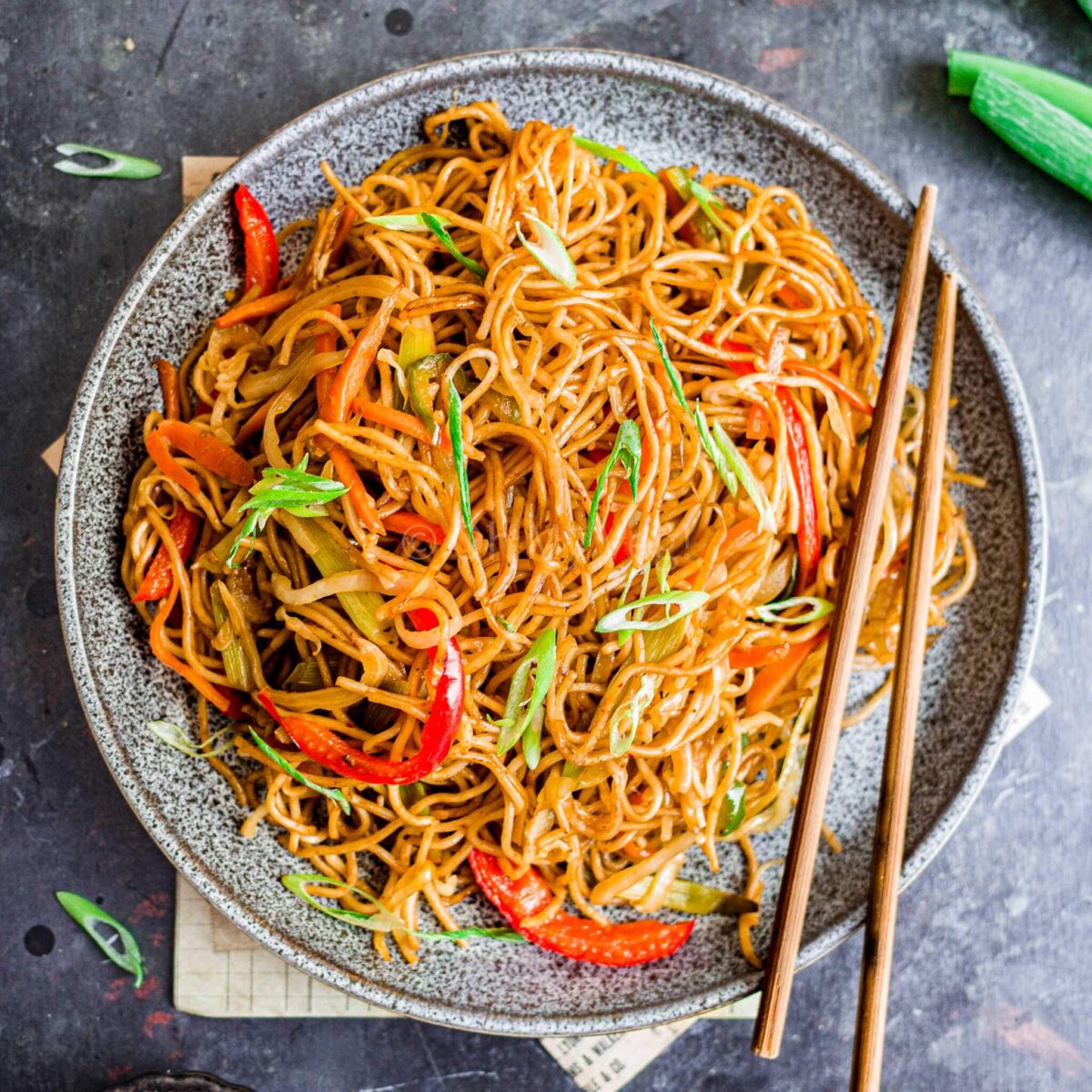 Veg hakka noodles on a plate.