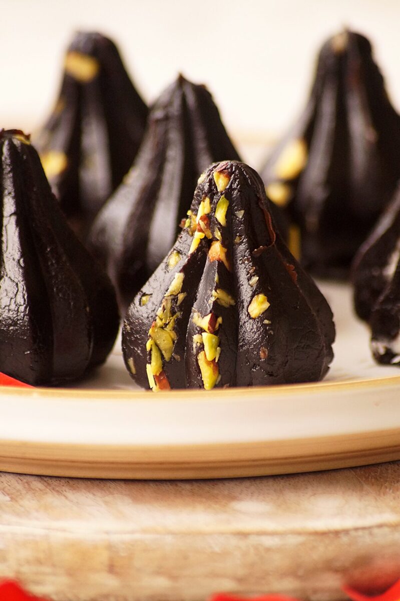 Oreo modak garnished with pistachios.