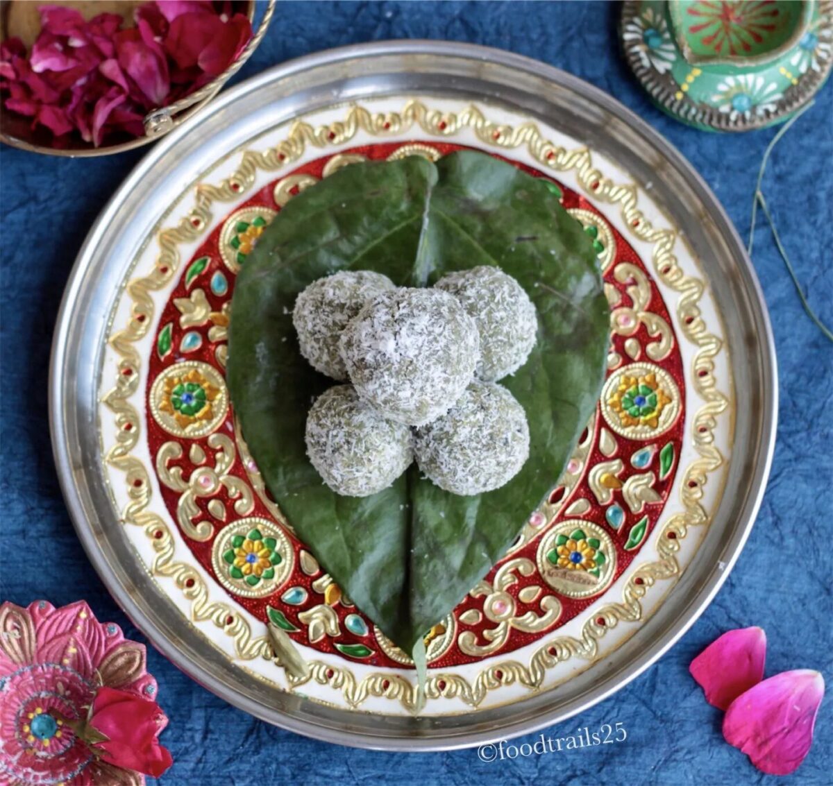 Coconut paan ladoo on leaf.