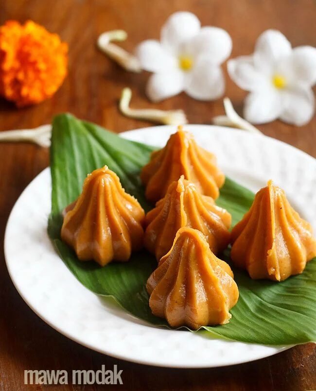 Mawa modak on a banana leaf.