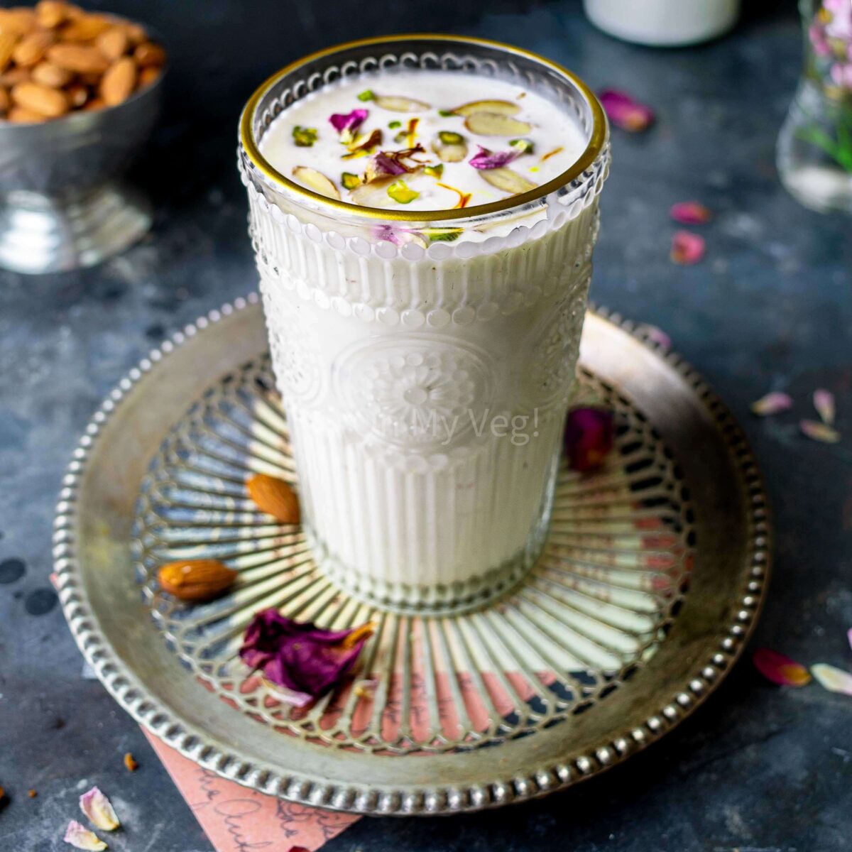 Piyush drink in a tall, gold-rimmed glass.