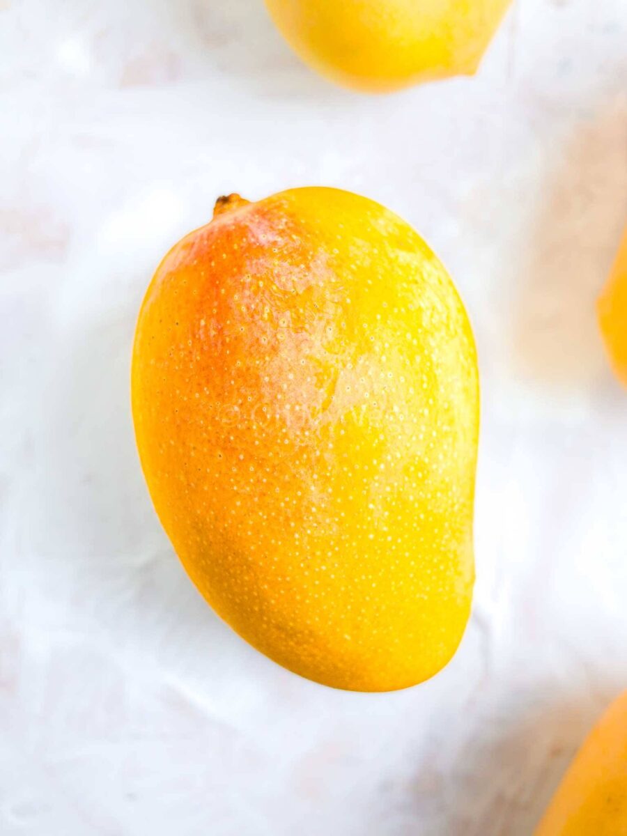 Alphonso mango on a white background.