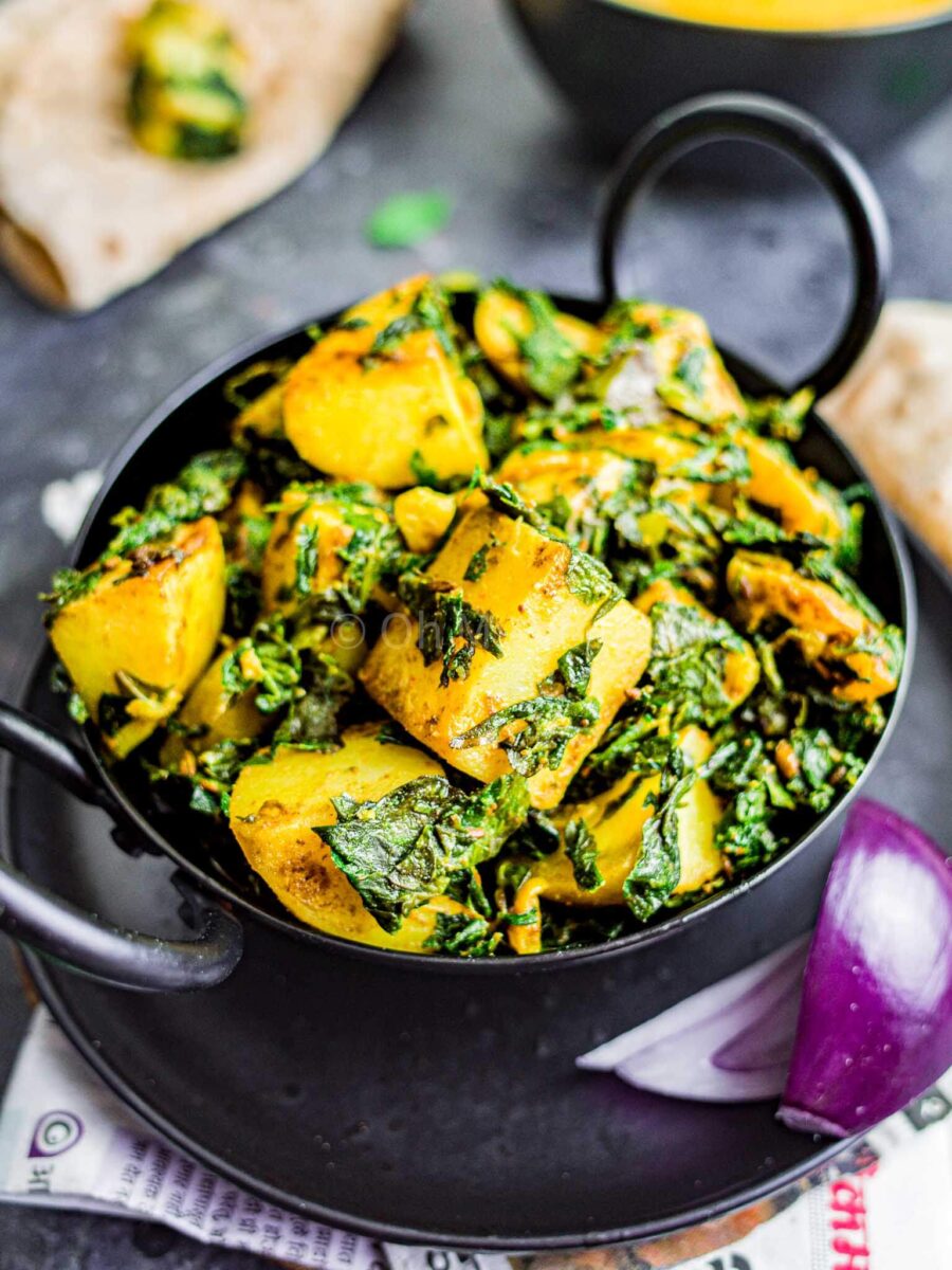 Aloo methi in a small iron kadai.