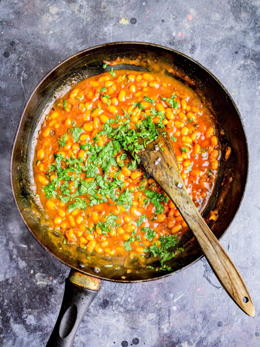 Baked beans curry in a frying pan.