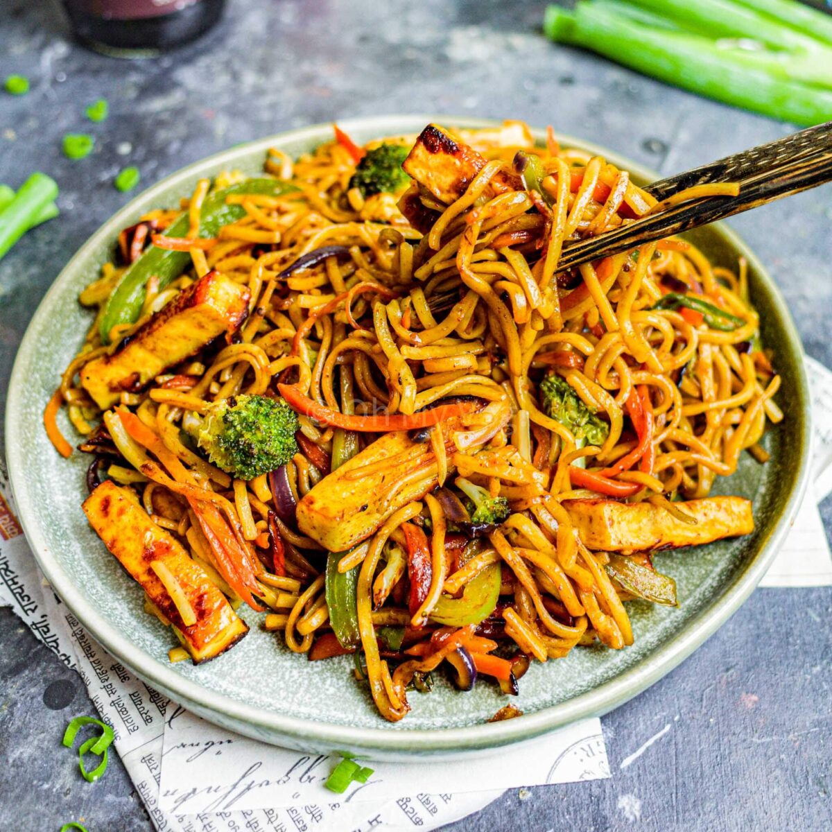 Paneer hakka noodles with chopsticks serving.