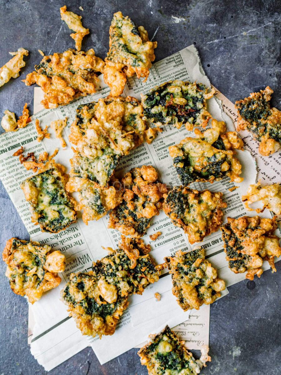 Seaweed chips scattered on newspaper.