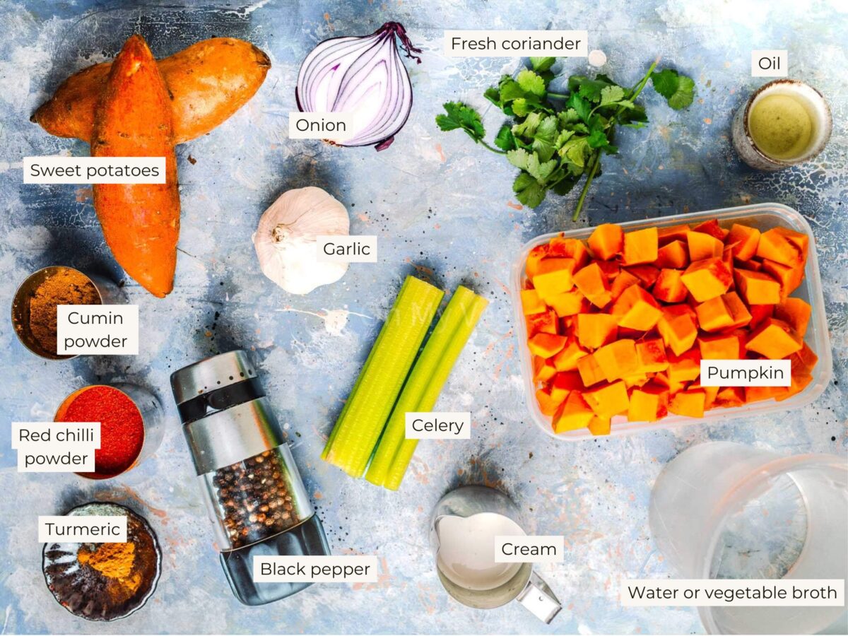 Ingredients for pumpkin and sweet potato soup on a blue background. 