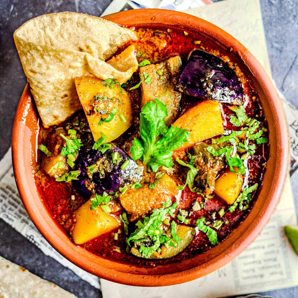 Vangi batata bhaji in a clay bowl.