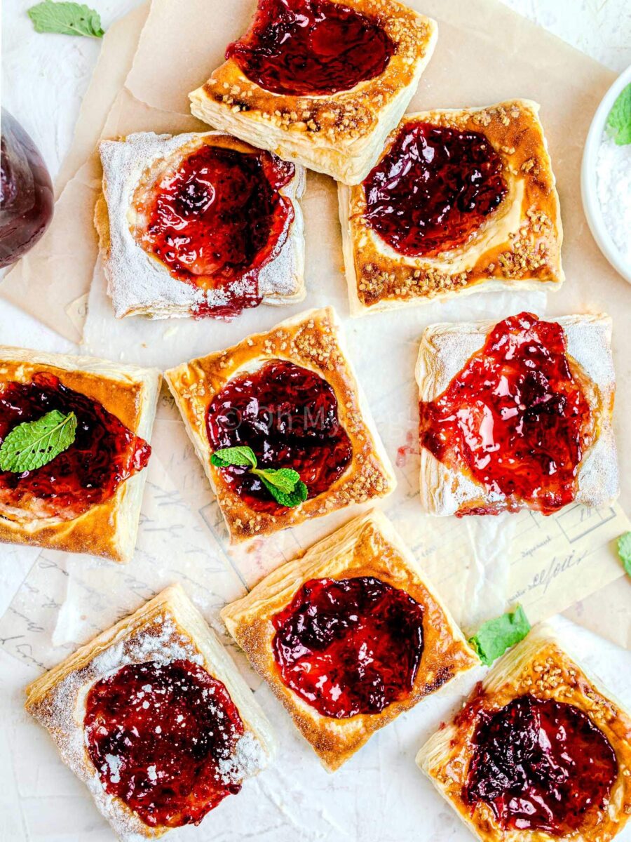 Puff pastry jam tarts on a white background. 