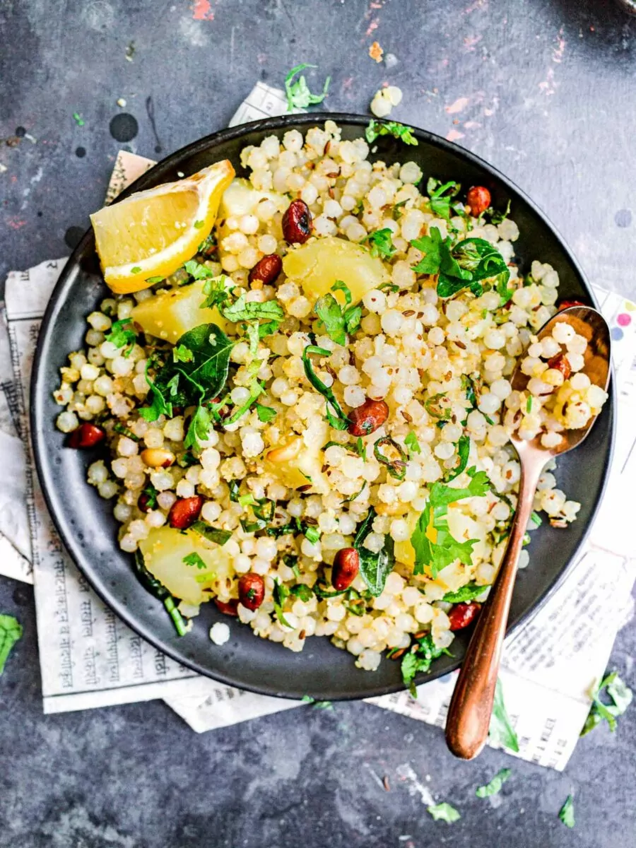 Plate of sabudana khichdi with lemon.